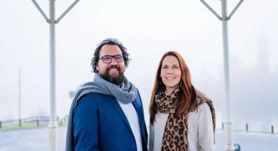 Two people smiling.